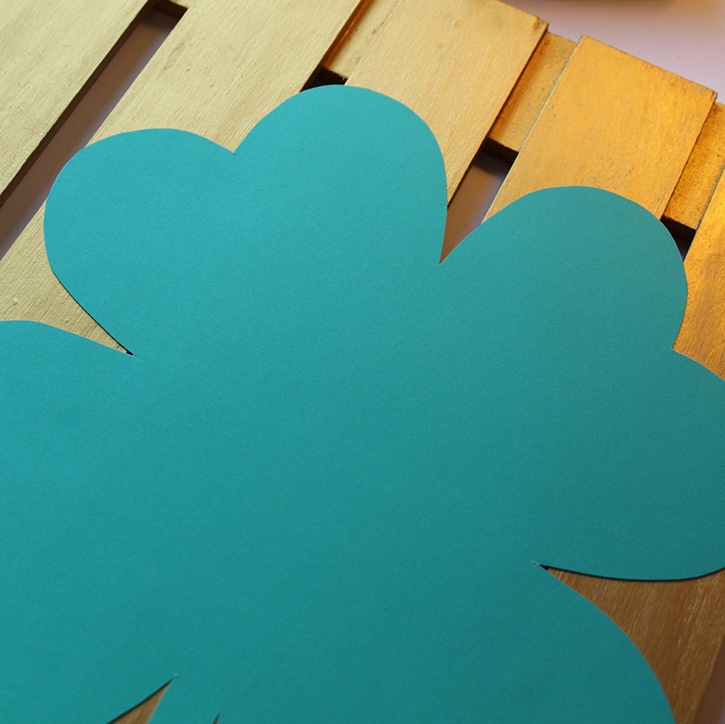 clover-button-art-adhering-paper-clover-to-pallet-with-glue-lines.jpg