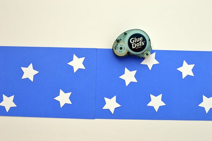 glue-dots-kids-craft-patriotic-windsock-adding-stars.jpg