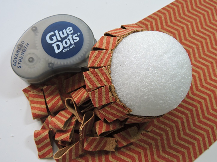 glue-dots-corky-pumpkins-cork-pieces-glued-to-styrofoam-ball.jpg