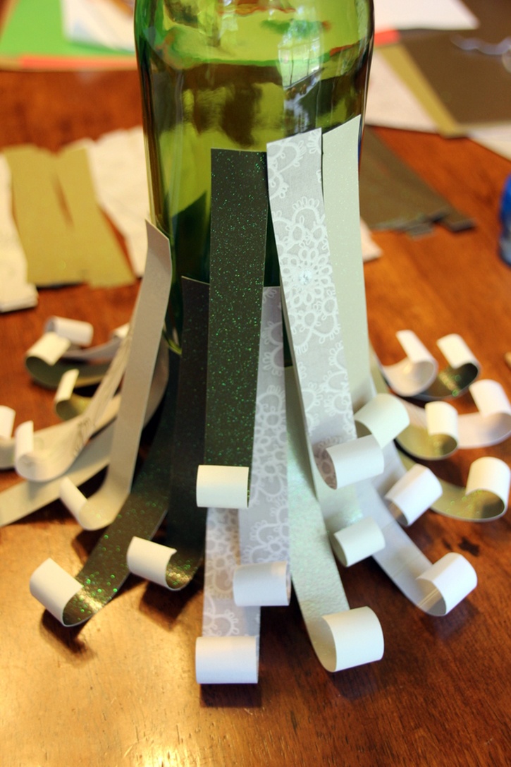 glue-dots-paper-scrap-wine-bottle-christmas-tree-halfway-complete.jpg