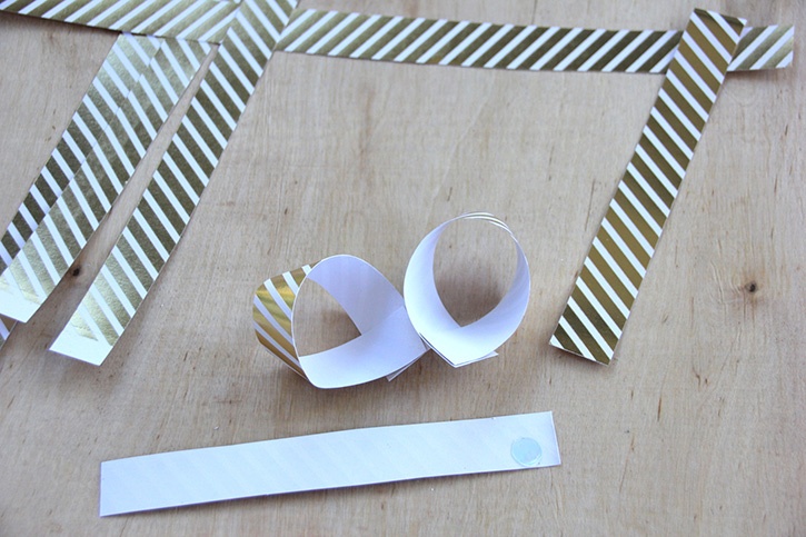 glue-dots-paper-gift-bow-cut-strips-glued-loops.jpg