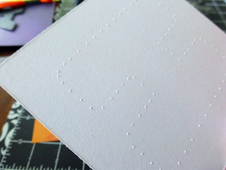 glue-dots-halloween-banner-piercing-paper-for-threading-back.jpg
