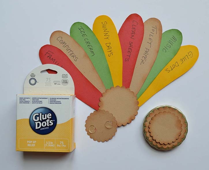 glue-dots-turkey-jar-thankful-notes-on-feathers.jpg